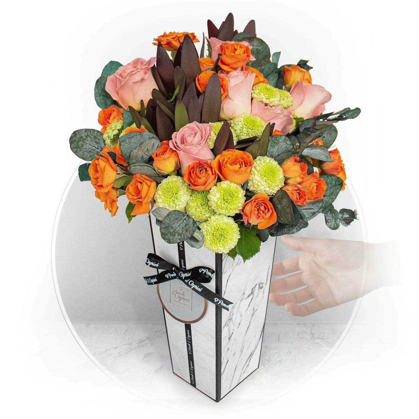 Arrangement of pink roses, orange roses and foliage mix with a silver balloon bunch
