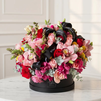 Arreglo-floral-de-Orquideas_Lisianthus_Rosas_Boca-de-Dragon-Domo Floreria Ponch y Caprico CDMX