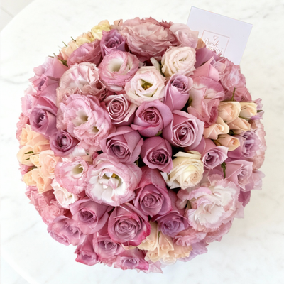 Floral arrangement of 60 roses lilac, pink and cream in box (dome)