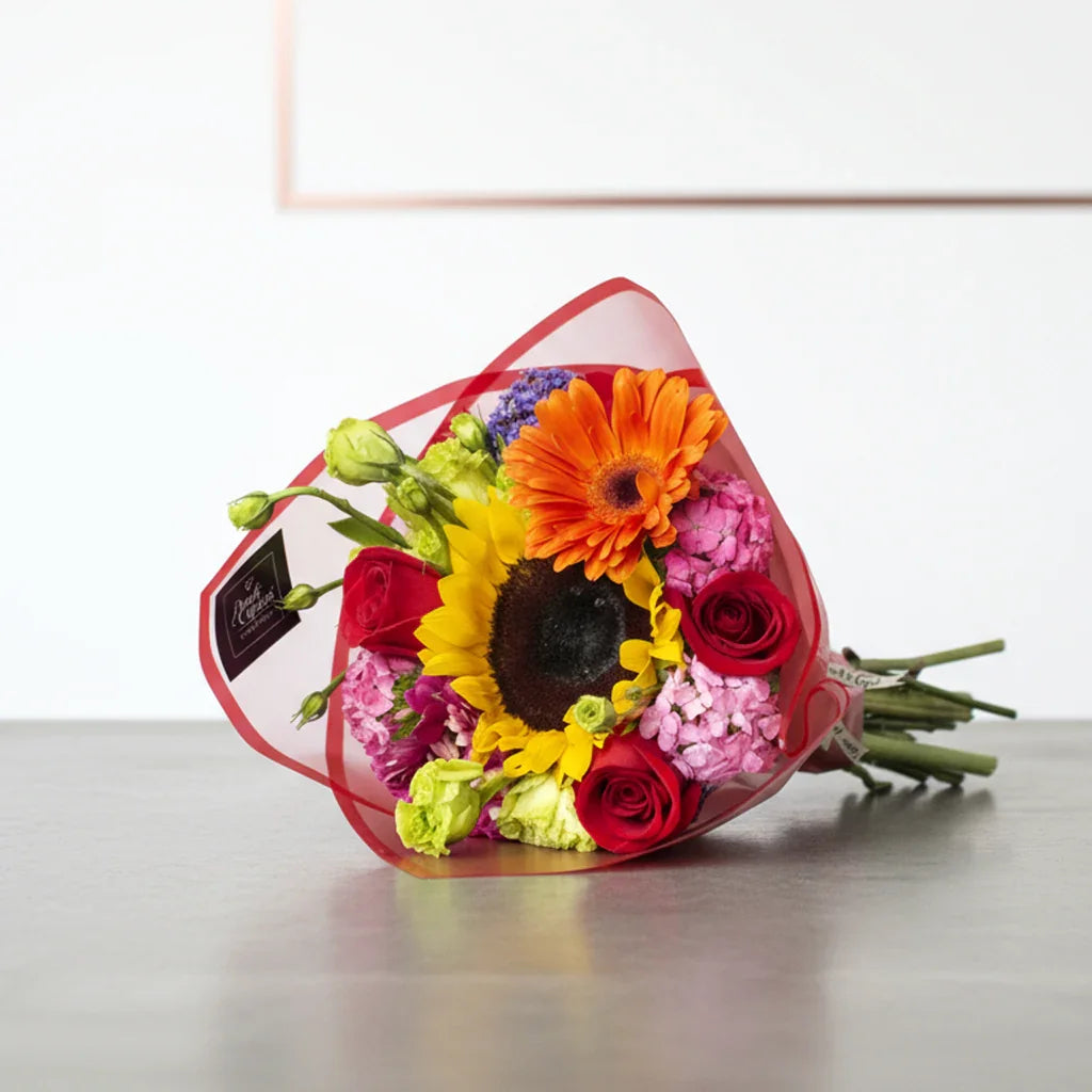 Bouquet of gerberas, mixed roses, lisianthus, lili, sunflower - florkery