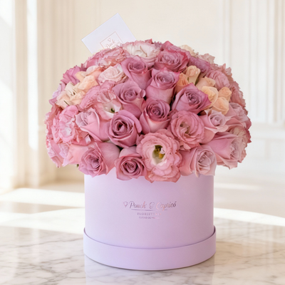 Floral arrangement of 60 roses lilac, pink and cream in box (dome)