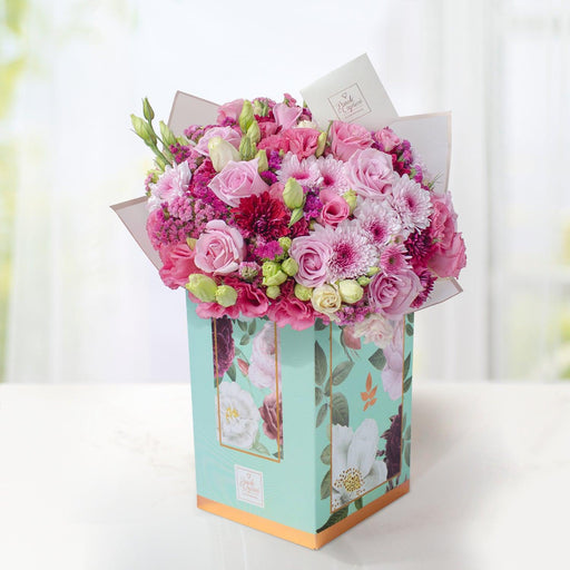 Arreglo Floral de Rosas Náuticas, Orquídea Blanca, Lisianthus Magenta y Moreliana  -GI031-
