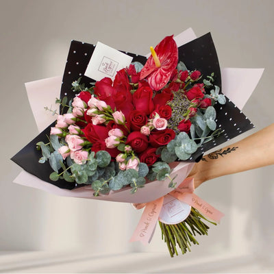 Red rose flower bouquet, mini caress, mini roses and red antur -